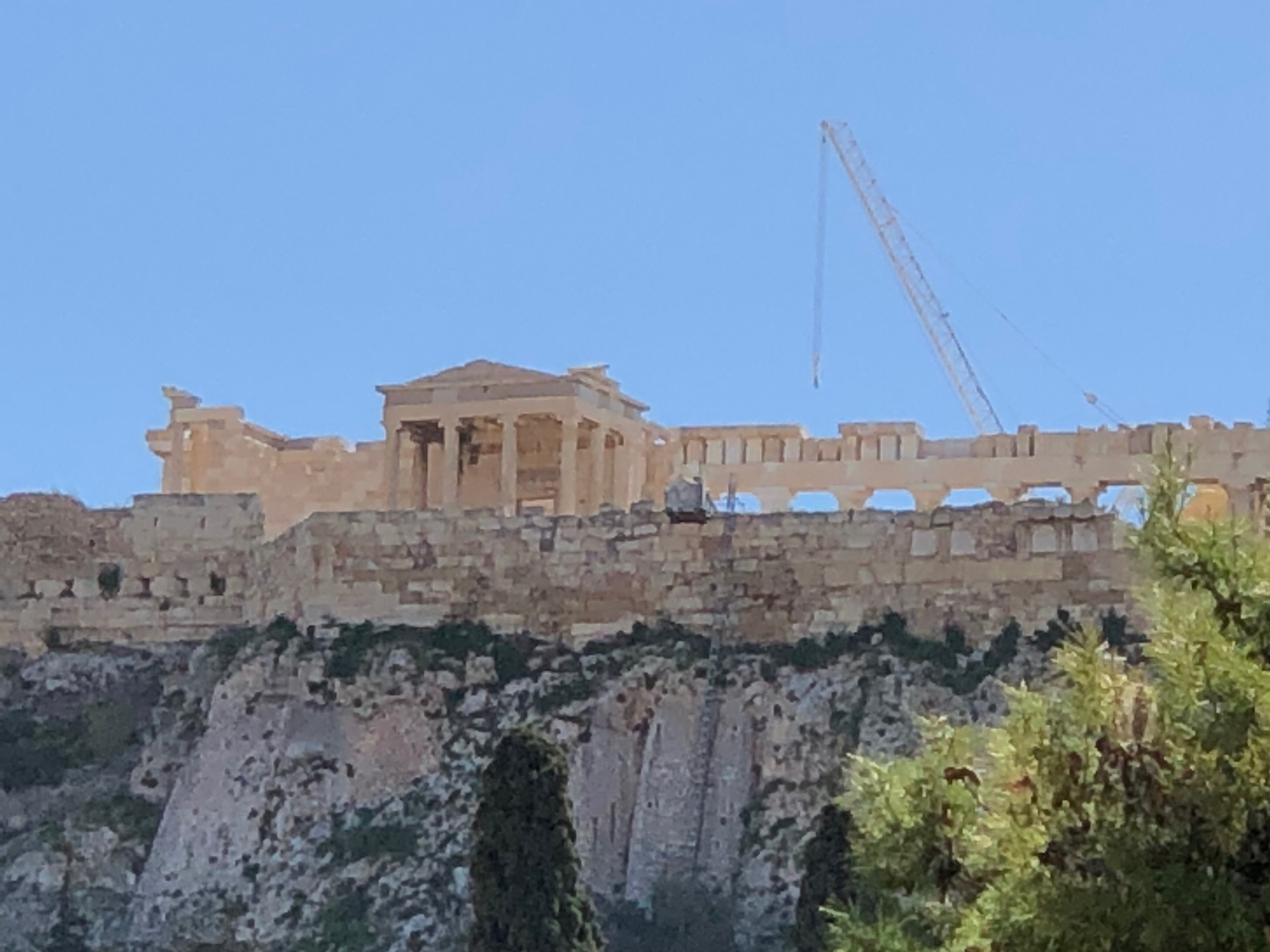 That’s the Erechtheion up there on the Acropolis (with the Parthenon peeking up behind it). The temple with the six maiden pillars on the other side.