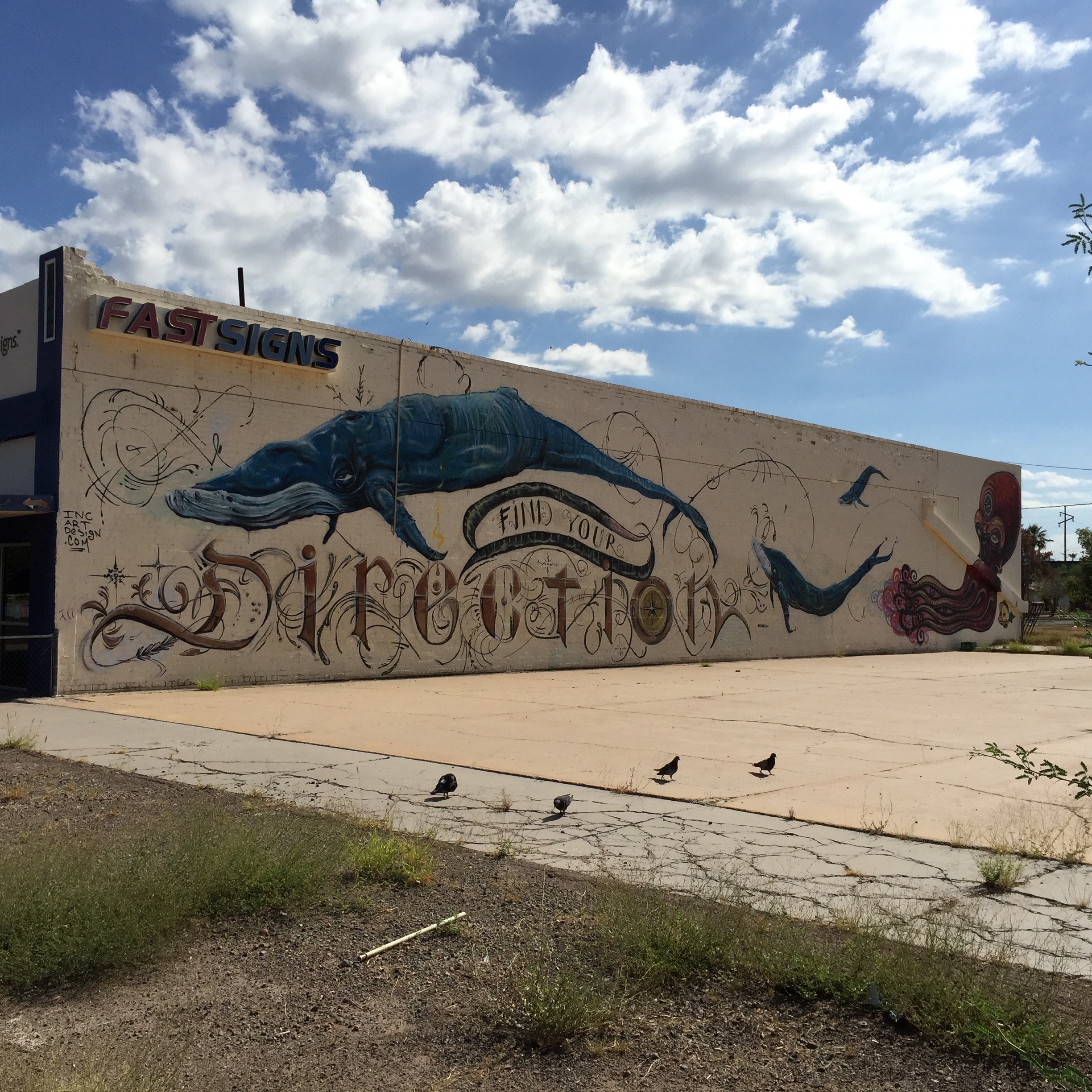 The whale on the Fast Signs building just north of my girlfriend.