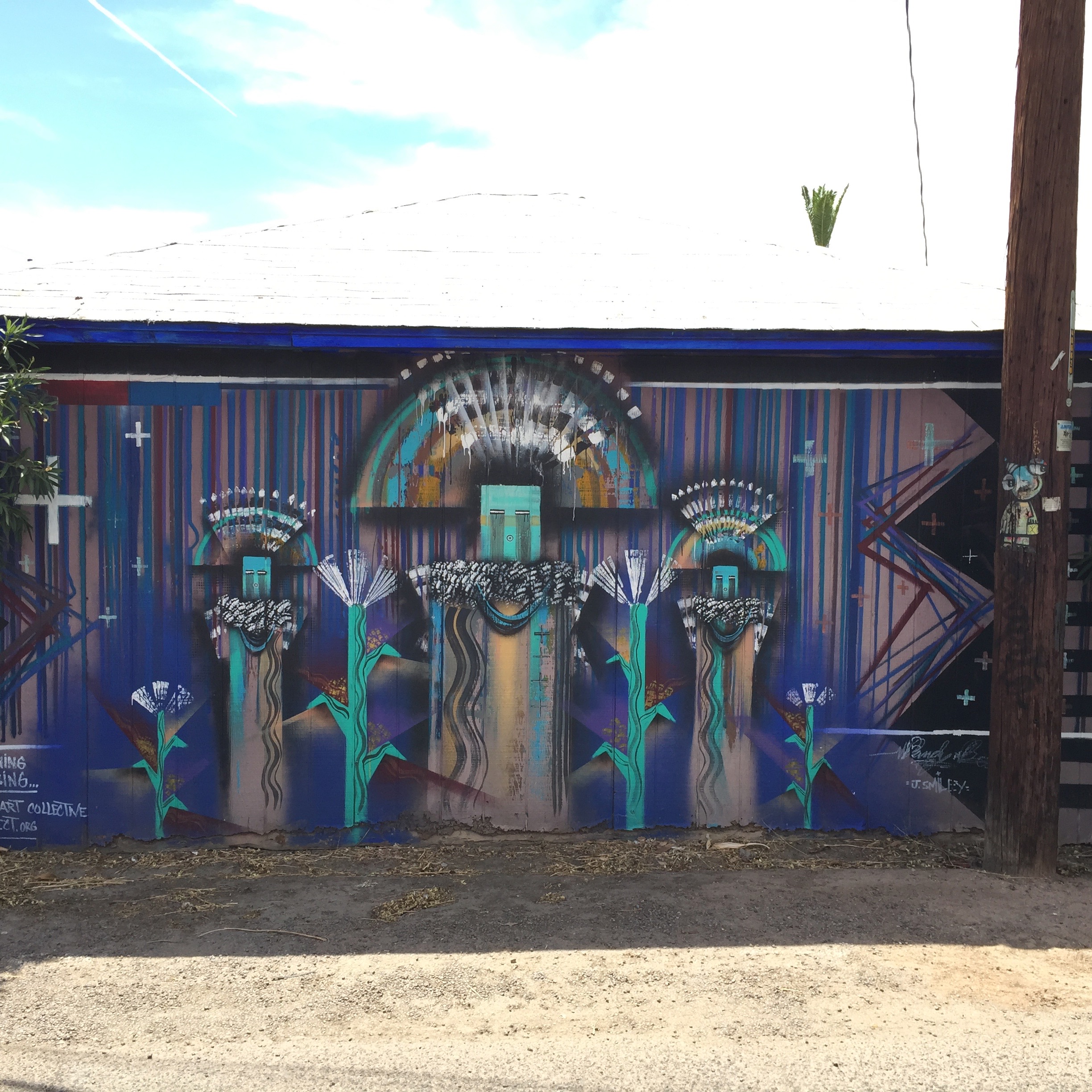 The back side of a shed or building of some kind behind Barrio Cafe.