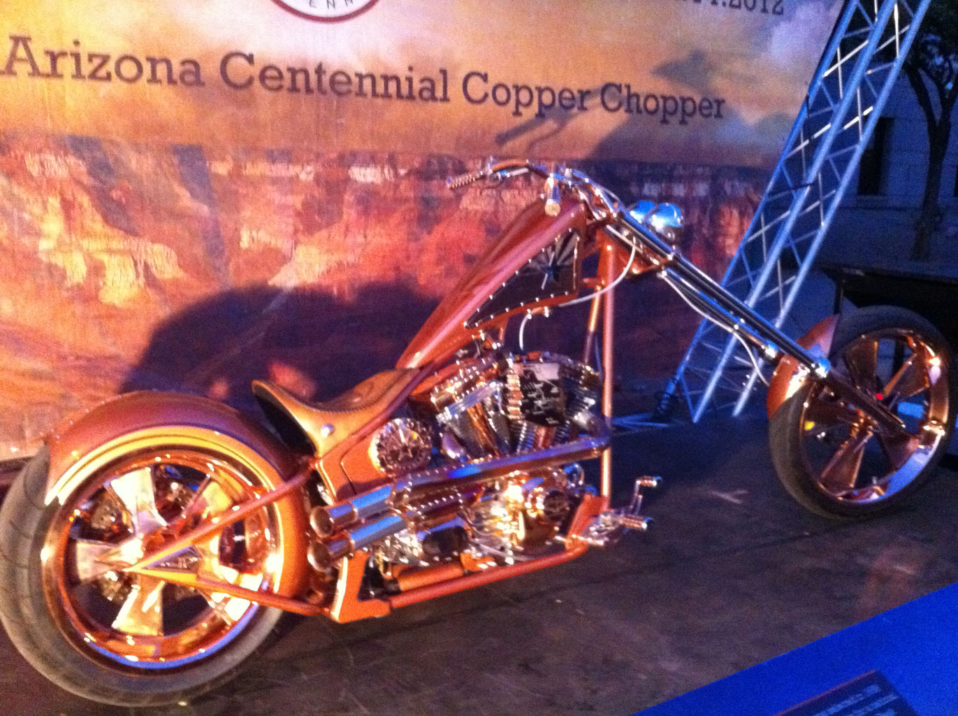 A classic low-rider motorcycle clad entirely in copper.