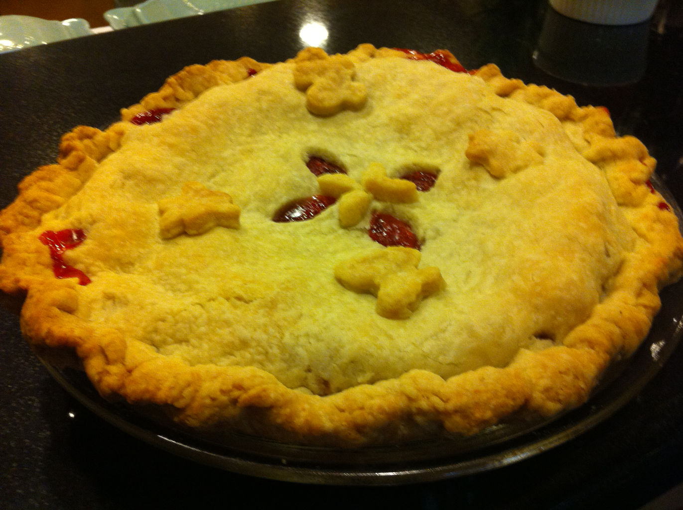 A beautiful pie with a top crust decorated with cut-out crust butterflies.